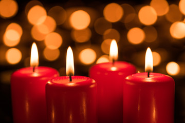 Four burning candles on the Fourth Sunday in Advent 