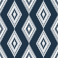 Ikat. Seamless pattern. Traditional ornament. Geometric background. Vector illustration for web design or print.