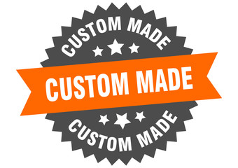 custom made sign. custom made orange-black circular band label