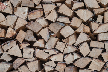 stacked pile of firewood for fireplace and stove