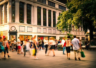 Motion blurred crowds of people on busy London street