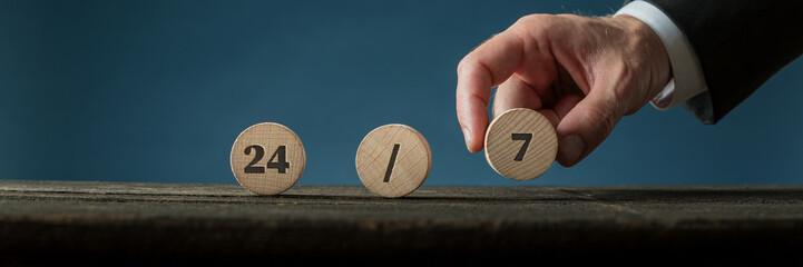24/7 sign on wooden circles