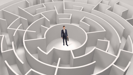 Young businessman standing in a middle of a 3d round maze