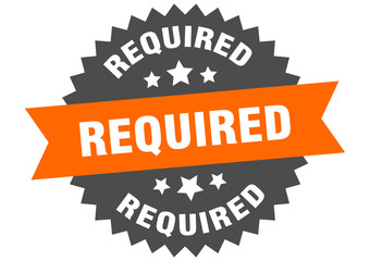 required sign. required orange-black circular band label