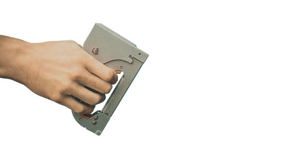 furniture stapler in hands, on a white background. isolated
