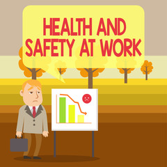 Conceptual hand writing showing Health And Safety At Work. Concept meaning Secure procedures prevent accidents avoid danger Businessman with Brief Case Standing Whiteboard Bar Chart