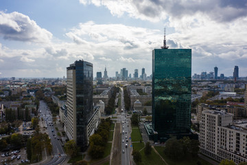 Plakat Aerial view of an urban metropolis with modern architecture and buildings at sunset. Warsaw. Poland. 19. September. 2019. Drone shot on cityscape business downtown.