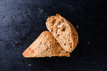 black rye bread on black slate