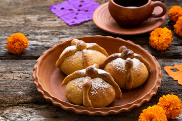 Mexican celebration, bread of death. Mexican parties with Dead bread and marigold flowers on gray...