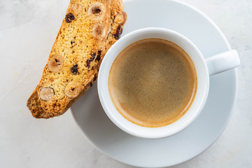 Christmas homemade cookies biscotti with dry berries and cup of coffee. Copy space.