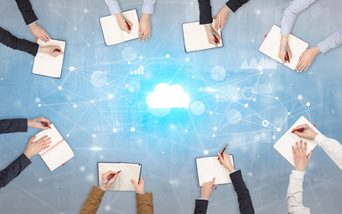 Group of people with devices in hands working on reports with online teamwork and cloud technology...