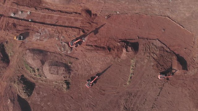 Heave Plant Machinery Moving Soil For Land Development Ground Works Housing Estate Bird's Eye View Aerial 4K Cine D