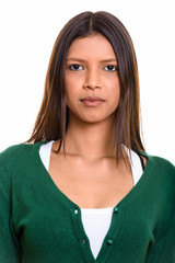 Face of young beautiful Brazilian woman looking at camera