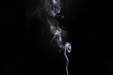 abstract fragment movement of white smoke on black background.