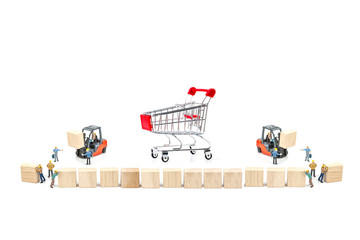 Miniature worker with wood block and shopping basket , shopping cart isolated on white background ,...