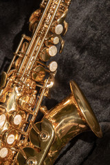 Fototapeta premium Tenor sax golden saxophone macro with selective focus on black