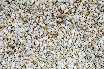 White background of small and natural stones.