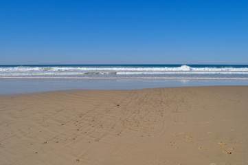 Fototapeta na wymiar Beach to sea view, under a clear blue sky