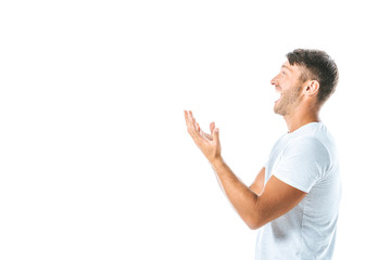 side view of excited man pointing with hands isolated on white