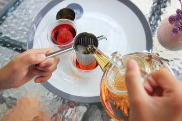 Tea organic in glass pot on the table,Close up selective focus.