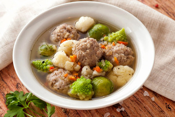 Hot thick soup with meatballs and cabbage mix.
