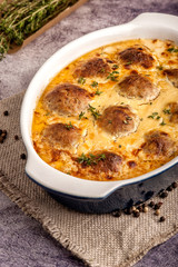 Meatballs baked in a thick sauce.