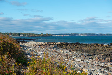 Fototapeta na wymiar Portsmouth Harbor Lighthouse and New Castle coast, from Odiorne Point State Park in Rye, New Hampshire, USA.