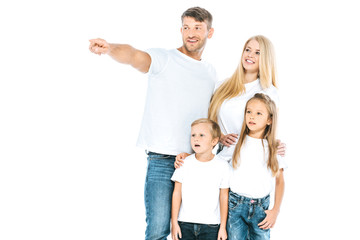 Fototapeta na wymiar happy father pointing with finger near kids and wife isolated on white