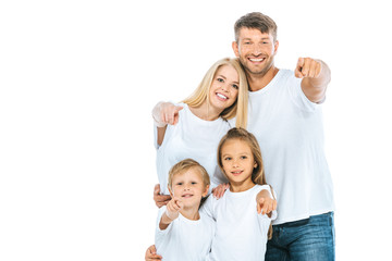 Fototapeta na wymiar positive family in white t-shirts pointing with fingers isolated on white