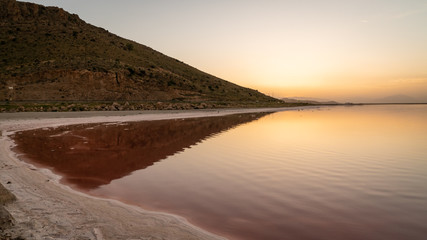 Sunset over the coast of Maharloo pink lake, Shiraz, Iran