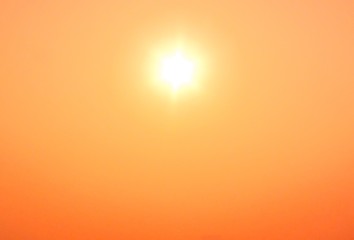 Shiny hot sun and orange sky sandstorm wildfire background