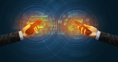 Close up of two smartphones syncing business data