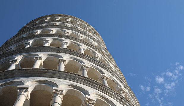 Detail of Pisa tower and blue sky