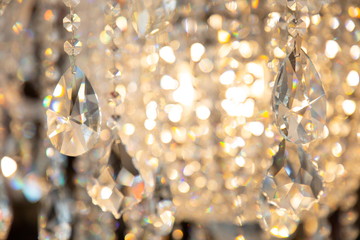 luxury hanging crystal chandelier shiny decoration interior , blur bokeh light lamp at background ....