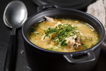 Barley soup with vegetables and chicken.
