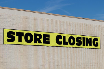 Store Closing sign close up on the side of a business