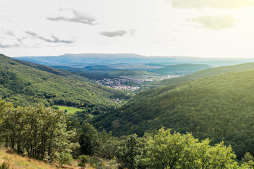 Naklejka premium distant view of small a mountain town