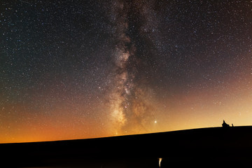 Beautiful milky way galaxy  Over the hill and small church silhouette.