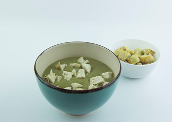 Cream of lentil and zucchini soup with chicken and parsley