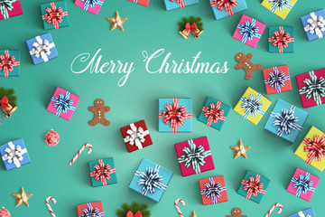 Merry Christmas and gift box on black background
