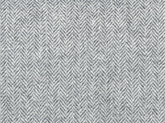 Elegant classic grey woolen fabric. Herringbone tweed, Wool Background Texture. Coat close-up....