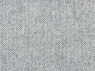 Elegant classic grey woolen fabric. Herringbone tweed, Wool Background Texture. Coat close-up. Expensive men's suit fabric. High resolution