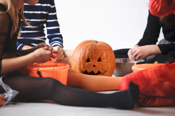 Cheerful Cute children in costumes ready for trick-or-treating Halloween holiday concept