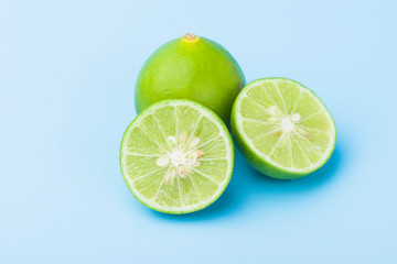 Close up fresh slice lime on blue