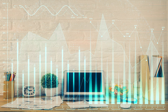 Financial graph colorful drawing and table with computer on background. Multi exposure. Concept of international markets.