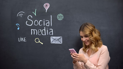 Girl posting message in social media using cell phone, global connection in net