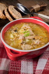 Barley soup with vegetables and chicken.