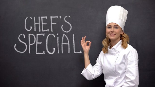 Female Senior Cook Showing Ok Sign Against Background With Chiefs Special Phrase