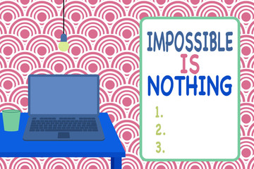 Conceptual hand writing showing Impossible Is Nothing. Concept meaning Anything is Possible Believe the Realm of Possibility Front view laptop lying on wooden desktop light bulb glass