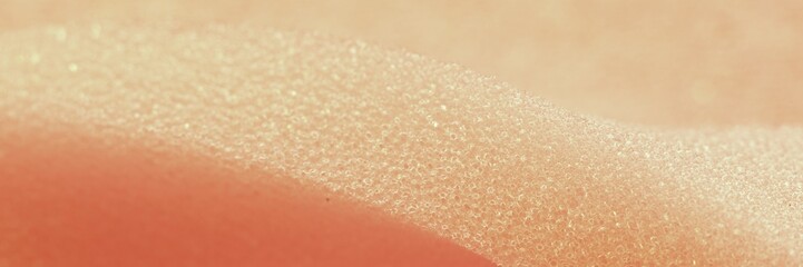 White pink artificial foam, soft texture on a light background.
